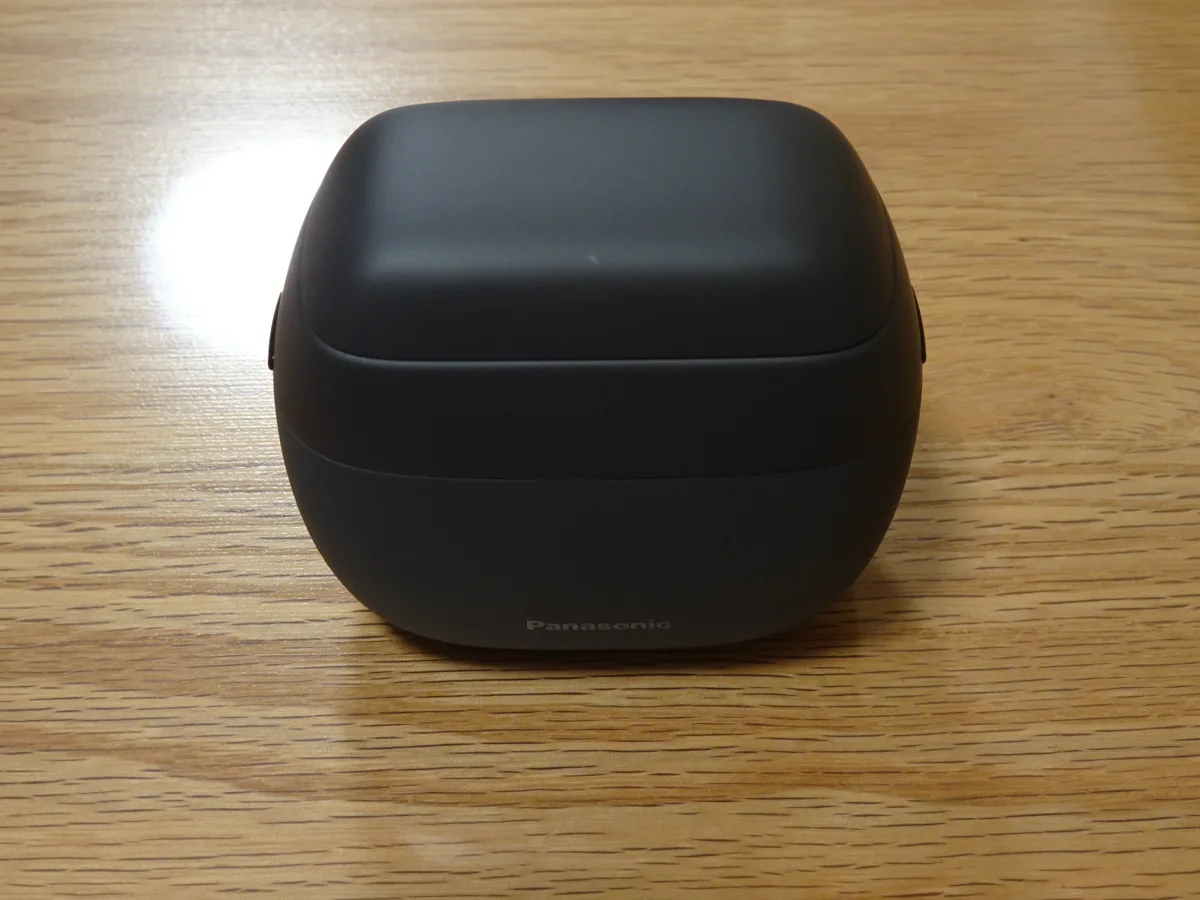 Matte-black Panasonic ES-PV3A-K shaver with its protective cap fitted