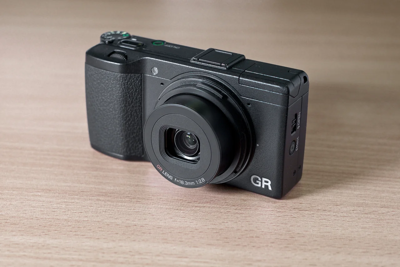 Black original Ricoh GR camera showing GR marking and 18.3 mm f/2.8 fixed lens
