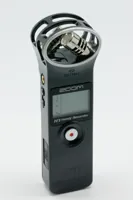 Original black ZOOM H1 handheld recorder with H1 model marking and X/Y microphones visible