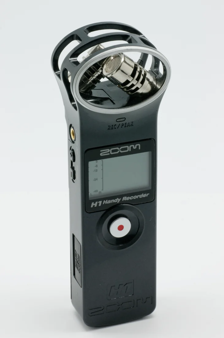 Original black ZOOM H1 handheld recorder with H1 model marking and X/Y microphones visible